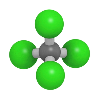 Ball-and-stick model of carbon tetrachloride showing central carbon atom bonded to four chlorine atoms.