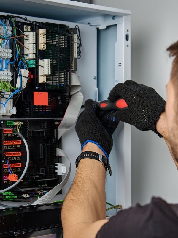 A technician is working on installing a heat pump.
