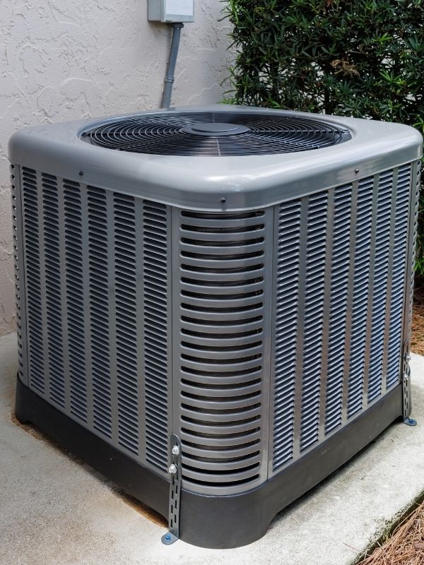 An air conditioning unit outside of a home.
