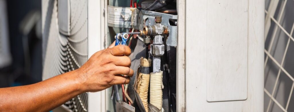Emergency repairs on a residential air conditioning unit.